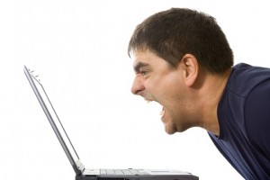 Daily activity: frustrated man shouting at laptop slightly frustrated there: man shouting at laptop